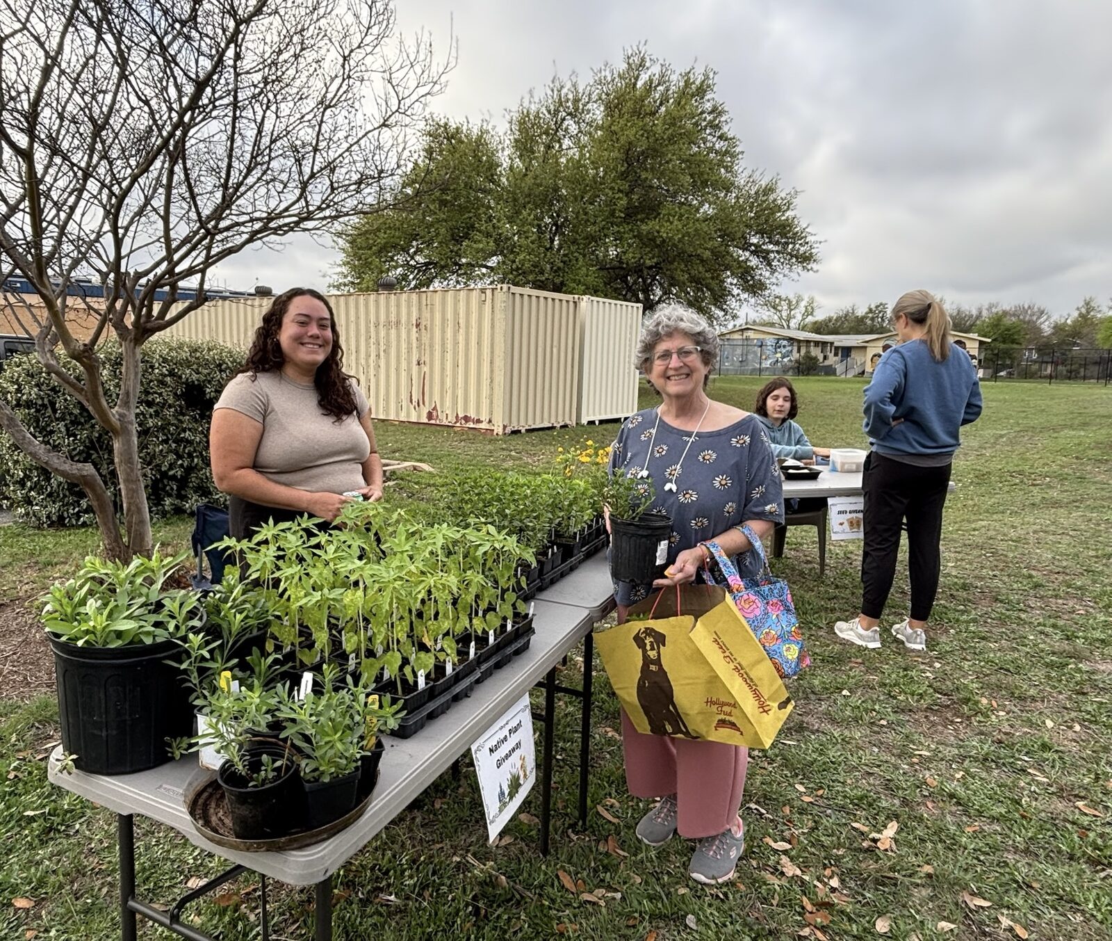 Makayla and volunteers at a community native plant sale